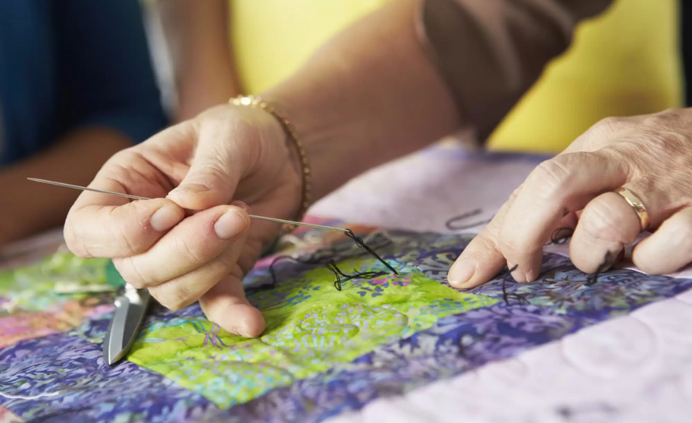 image of someone sewing